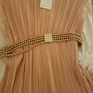 Nude color dress with lace and beaded belt